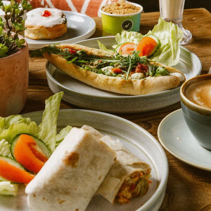 Freshly prepared wraps and baguettes for lunch on a table at a café.